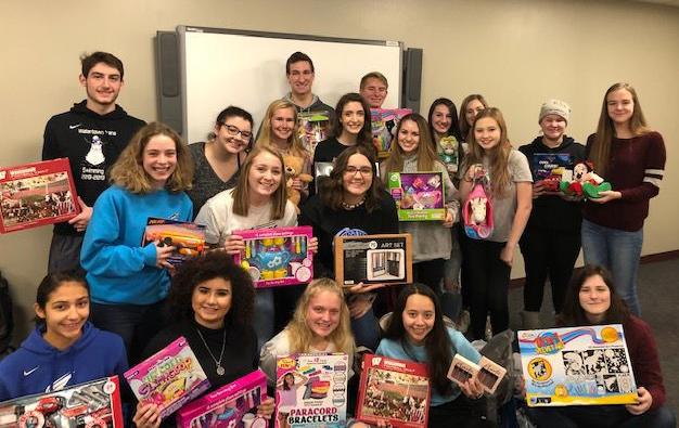 teens COLLECT TOYS FOR CHRISTMAS NEIGHBORS